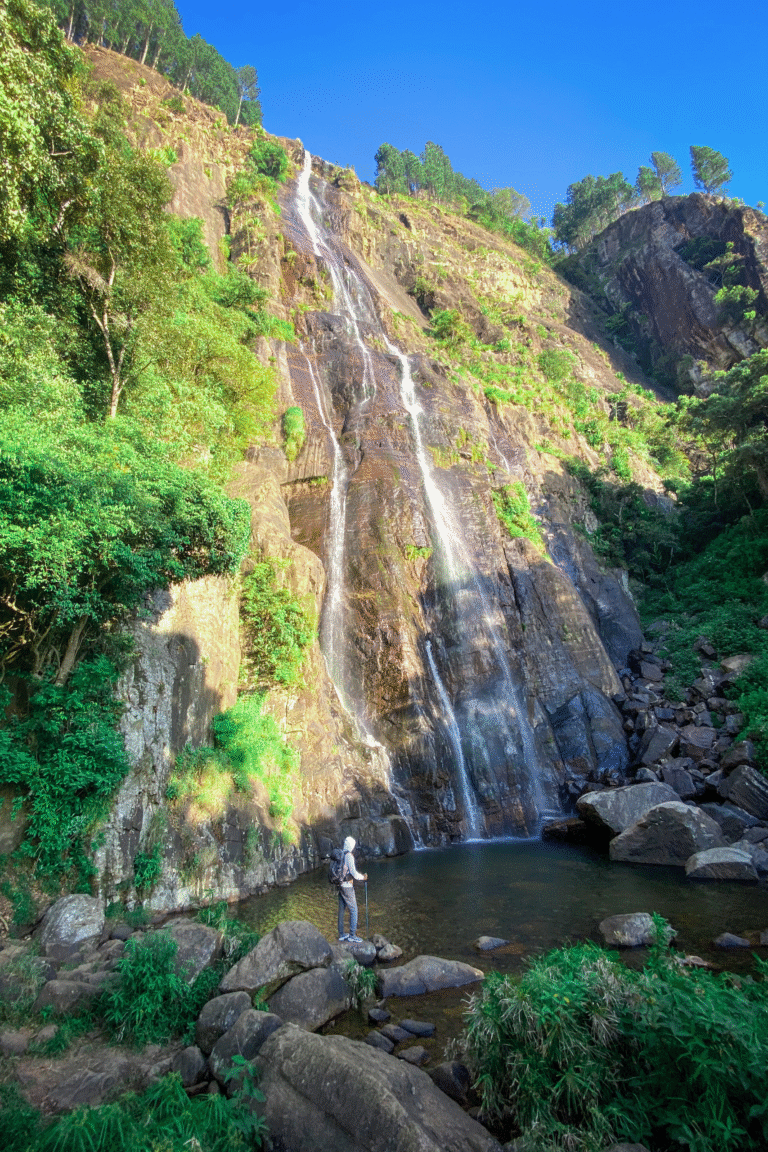 Tourists enjoying the scenic beauty of Bambarakanda Waterfall